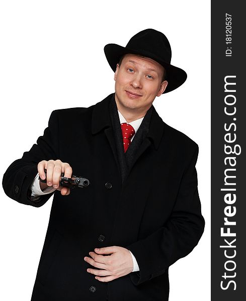 Man in a black coat and hat with a gun on a white background