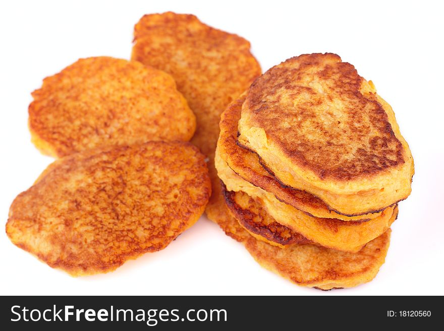 Fresh homemade fried pumpkin pancakes for breakfast isolated on white background