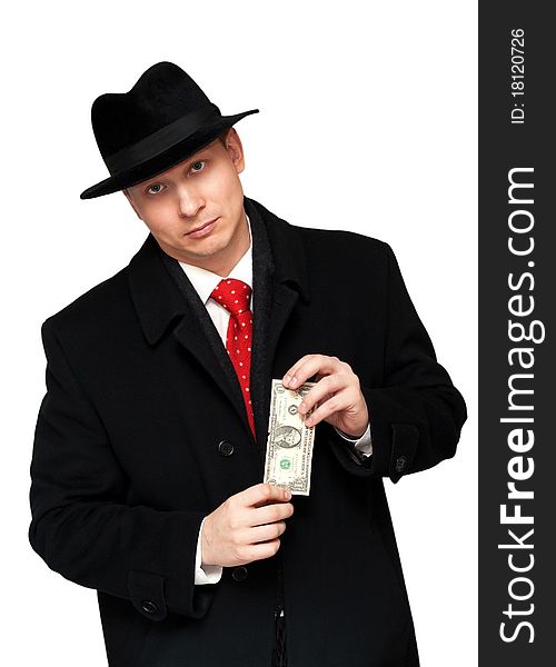 Man in an overcoat and hat, with the dollar in the hands of. Man in an overcoat and hat, with the dollar in the hands of