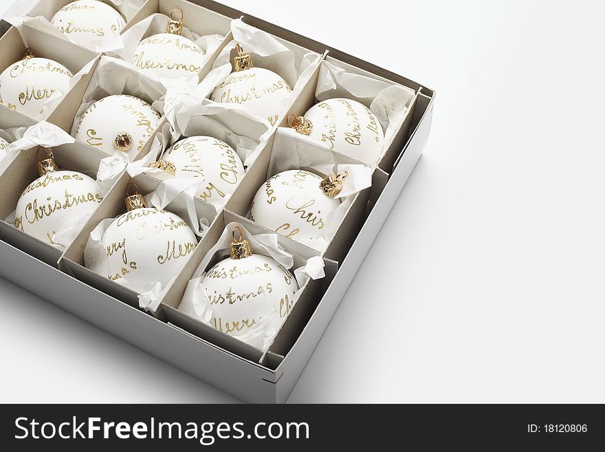 Close-up of White Christmas balls in box