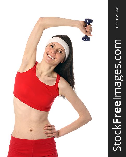 Happy young woman in red sport clothes exercising with a dumbbell; isolated on white. Happy young woman in red sport clothes exercising with a dumbbell; isolated on white