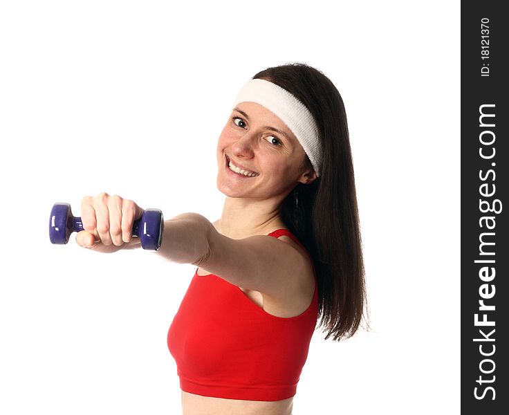 Happy young woman in red sport clothes exercising with a dumbbell; isolated on white. Happy young woman in red sport clothes exercising with a dumbbell; isolated on white