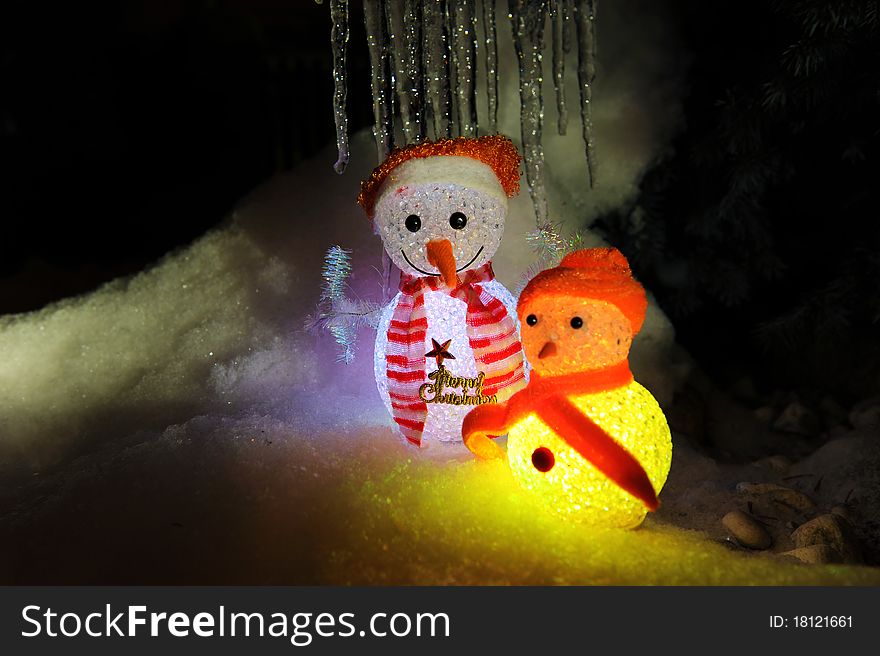 A small snow man toy doll as Christmas decoration.