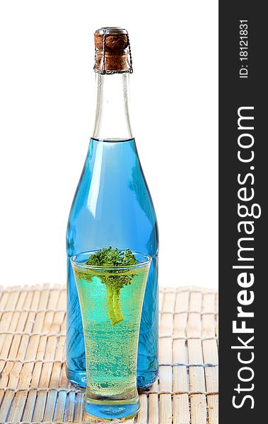 Blue colored carbonated party drink with white background.