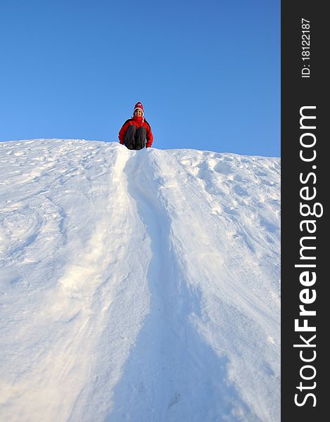 Woman sliding at snow slideway