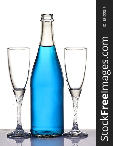 Two champagne glasses and a bottle isolated on white background. Two champagne glasses and a bottle isolated on white background