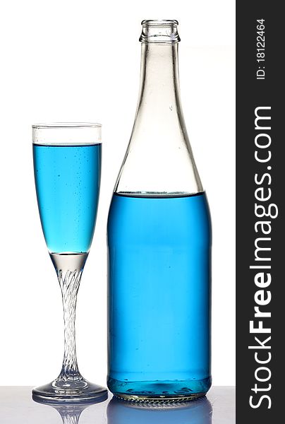 Champagne glasse and a bottle isolated on white background. Champagne glasse and a bottle isolated on white background