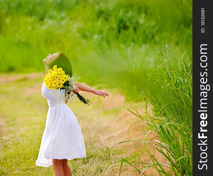 Carefree adorable girl with arms out in field. summer freedom andjoy concept. Carefree adorable girl with arms out in field. summer freedom andjoy concept.