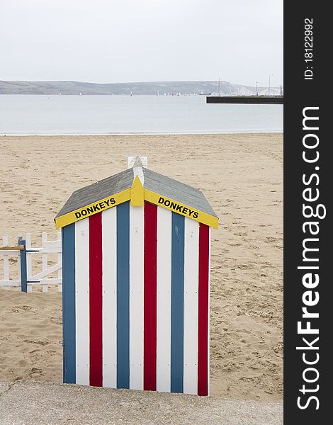 Colourful Donkey Ride beach hut on Weymouth Beach