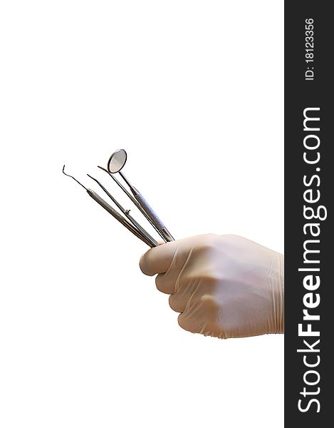 Hand in glove holding dentist instrument. Hand in glove holding dentist instrument