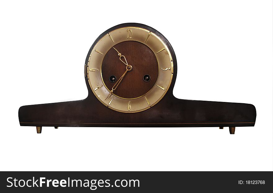 A vintage mantel clock wooden with gold numbers and hands