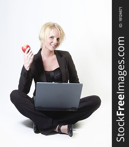 Businesswoman sitting with laptop isolated