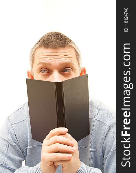 Man Looking Up Behind A Book