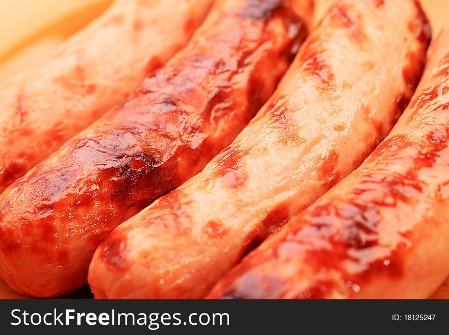 Close-up of appetizing grilled sausages.