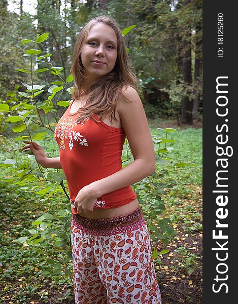 Girl in ethnic clothes outdoor in the park