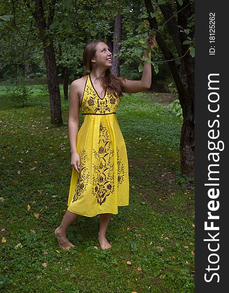 Girl in ethnic clothes outdoor in the park