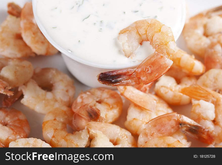 Fried shrimps on a plate and sauce