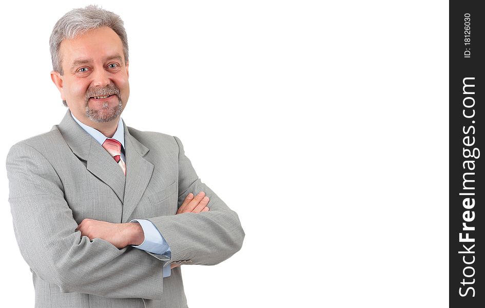 Mature successful businessman smiling and looking at camera in a modern office building