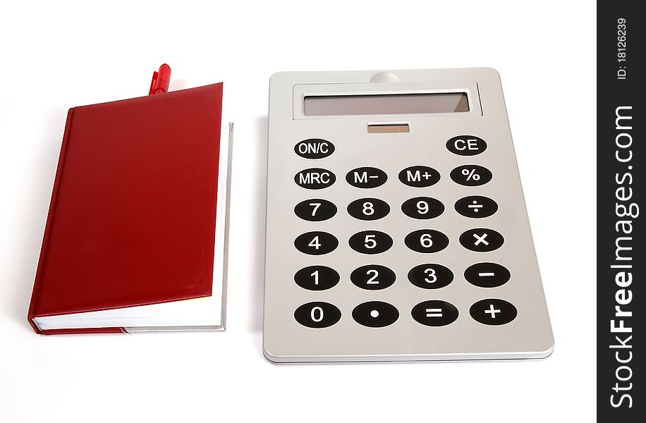 Great calculator and red notebook for reference daily notes with a pen on a white background
