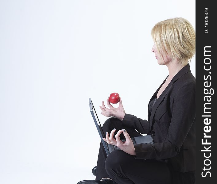 Businesswoman sitting with laptop isolated