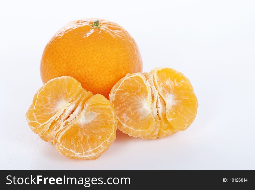 Ripe tangerines on white background.