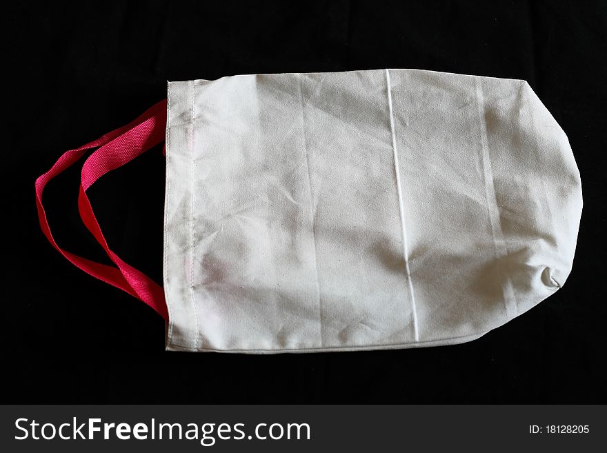 Cotton white bag on black background