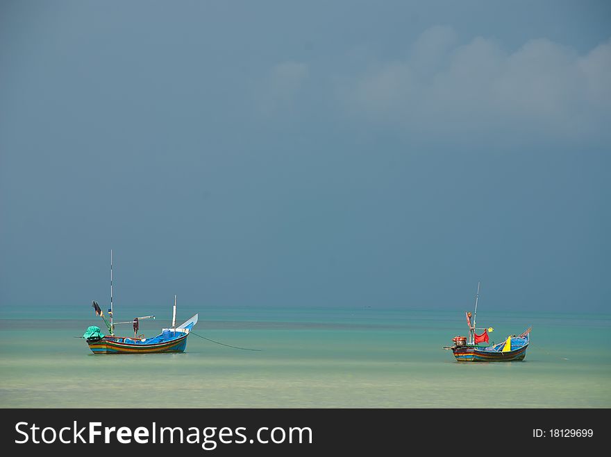 Two longtail boat in the sea