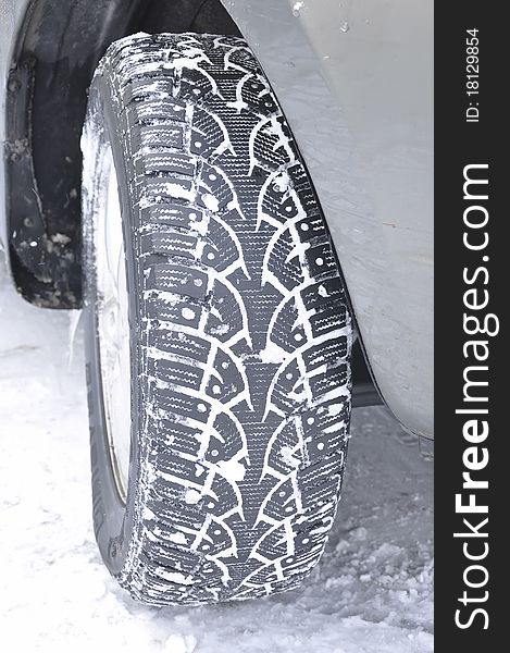Closeup of a car wheel in snow. Closeup of a car wheel in snow