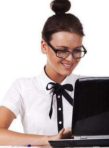 Woman With Glasses Sits At A Table And Working Royalty Free Stock Photography Woman With Glasses Sits At A Table And Working Royalty Free Stock Photography