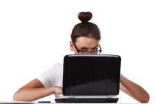 Woman With Glasses Sits And Working On Laptop Stock Photo