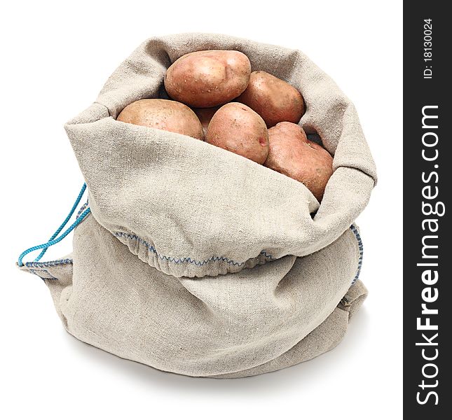 Sack of potatoes raw vegetables isolated on white background.