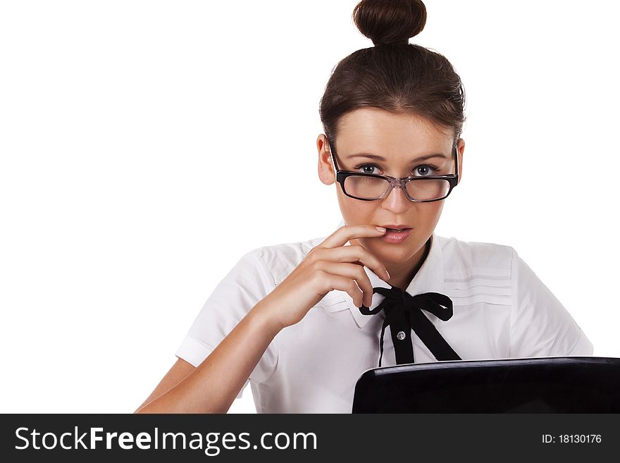 Woman with glasses sits and working on laptop