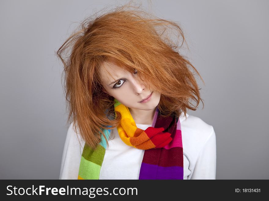 Red-haired rock girl in scarf. Studio shot.