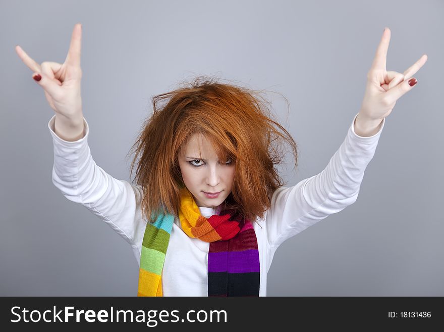 Red-haired rock girl in scarf. Studio shot.