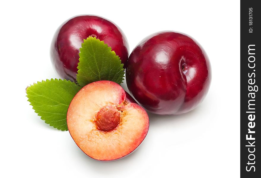 Ripe bright plums closeup on white background. Ripe bright plums closeup on white background