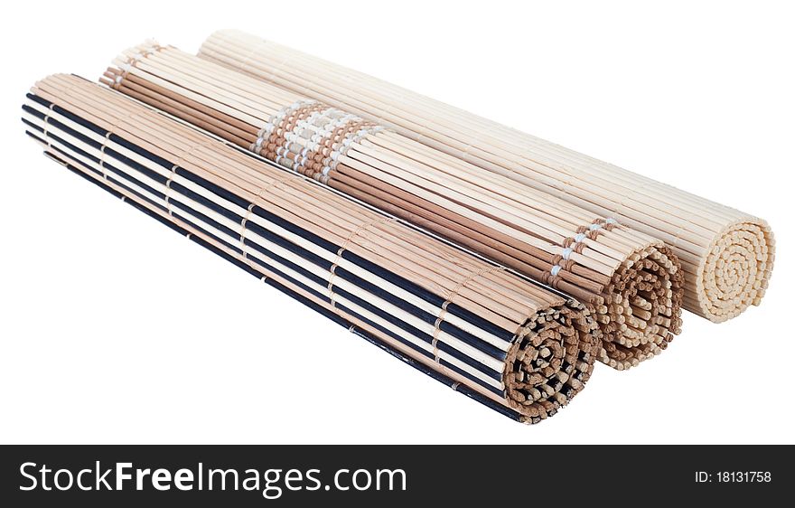 Three rolled up bamboo mat