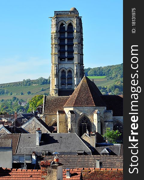 Church and its tall bell tower on the hills of Champagne. Church and its tall bell tower on the hills of Champagne