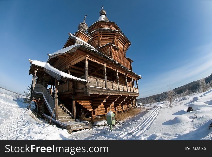 Snow-covered wooden church in winter day. Snow-covered wooden church in winter day