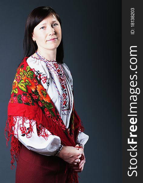 Young ukrainian woman in traditional dress in studio
