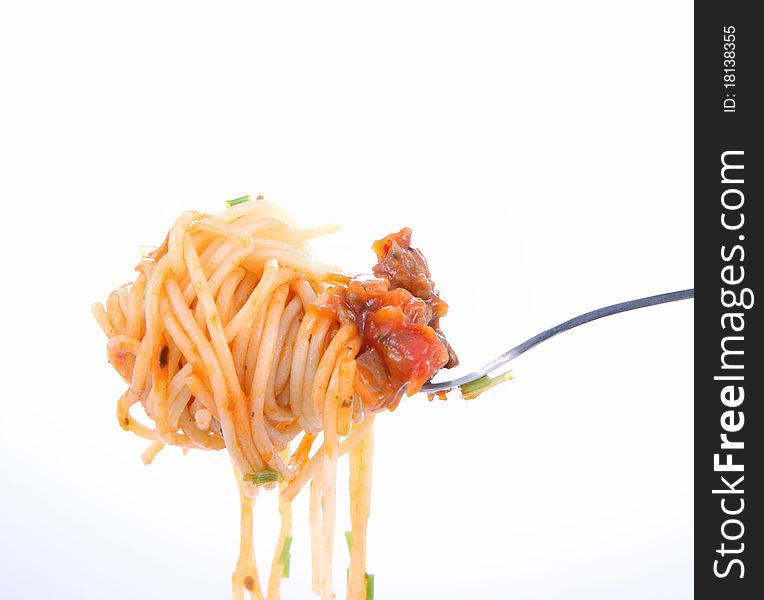 Spaghetti with sauce bolognese hanging on a fork. Spaghetti with sauce bolognese hanging on a fork