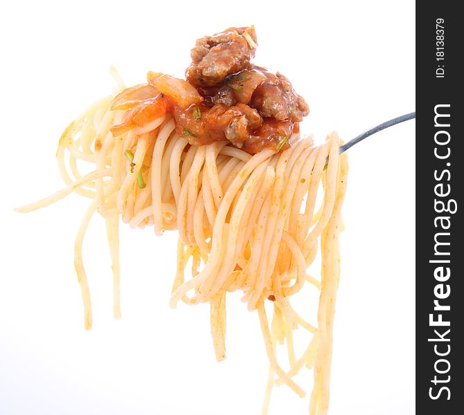 Spaghetti with sauce bolognese hanging on a fork. Spaghetti with sauce bolognese hanging on a fork