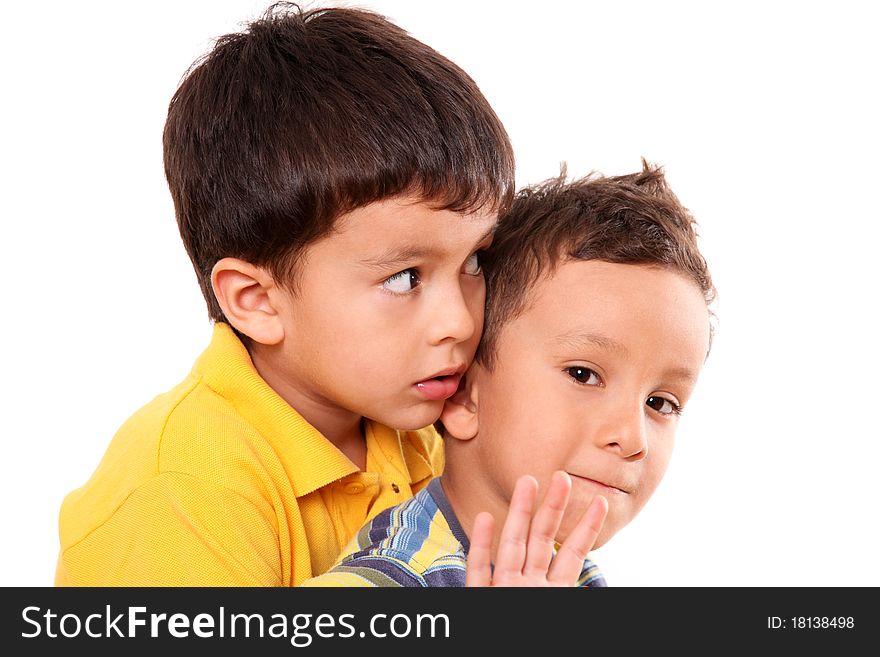 Children huddled looking at different directions with a hand in sign of stop