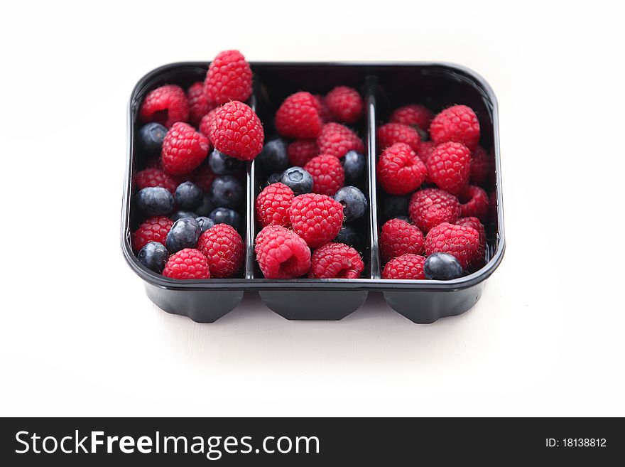 Raspberry and blueberry in packing