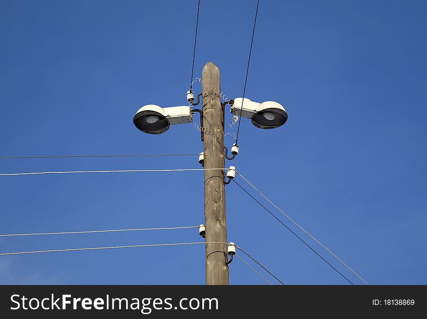 Street lighting. Village. Against the blue sky