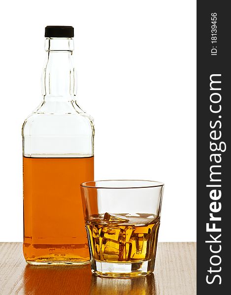 Whiskey bottle with glass isolated