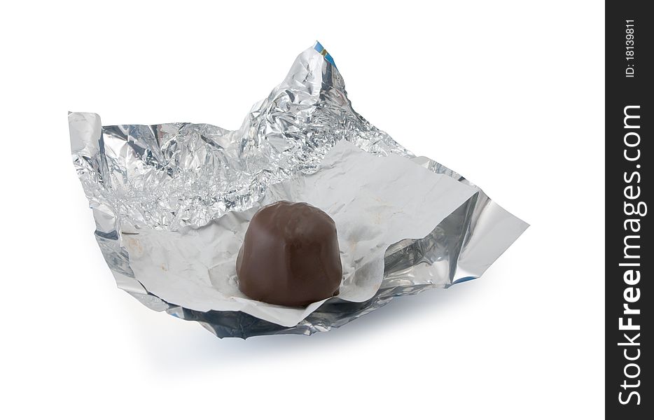 Chocolate on a foil isolated on a white background