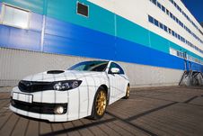 White Sport Car On Background Industrial Building Stock Photo