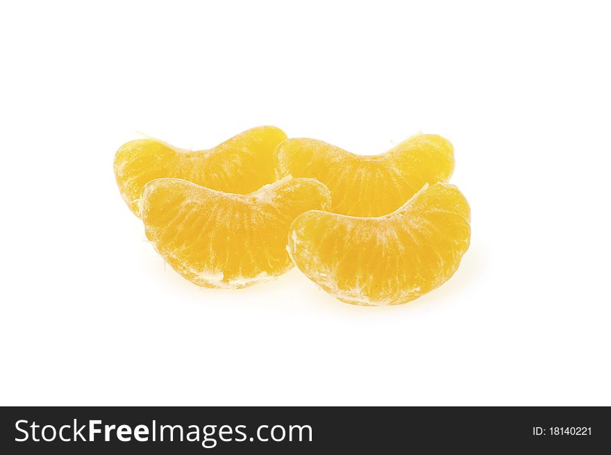 Slices of peeled mandarine on a white background