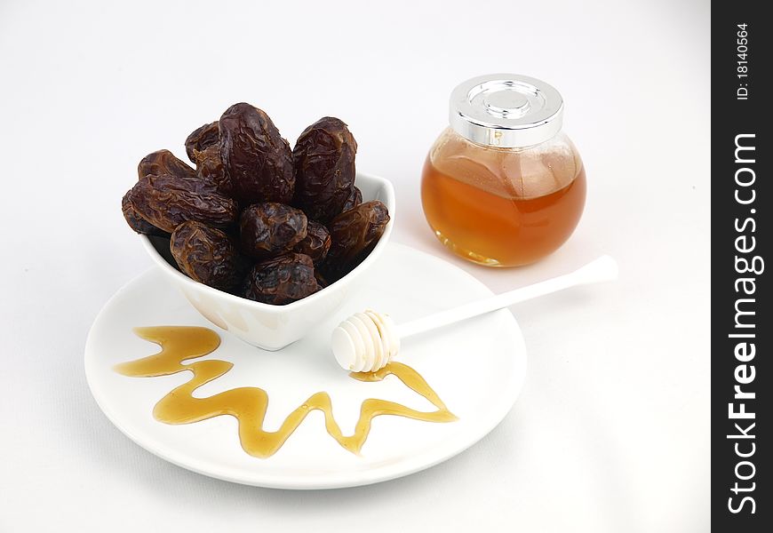 Bowl of dried dates with honey. Bowl of dried dates with honey