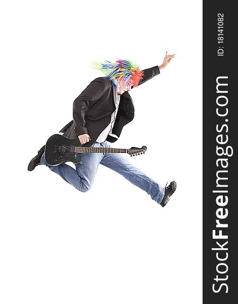 Young guy jumping with guitar